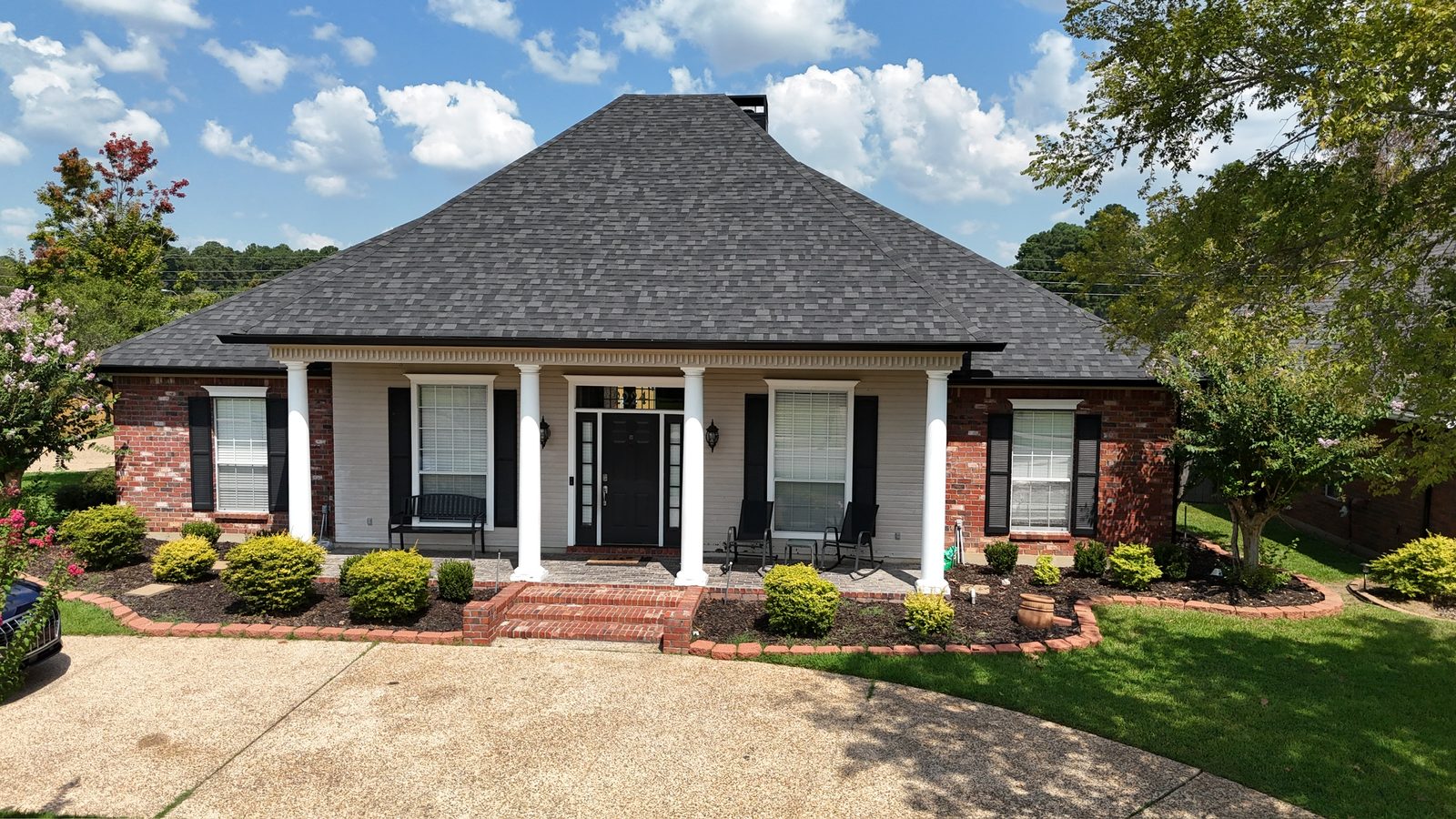 Aerial view of a completed shingle roof replacement in a Shreveport-Bossier City neighborhood
