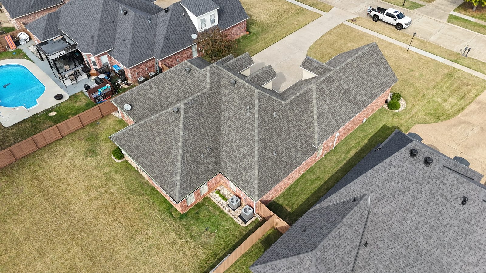 Aerial view of a completed shingle roof replacement in Shreveport-Bossier City