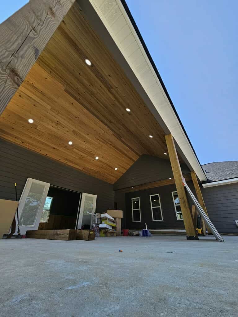 Barndominium covered patio with cedar tongue-and-groove ceiling in Shreveport