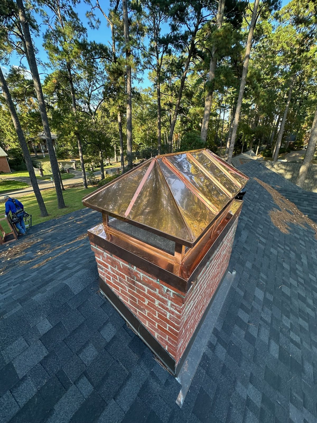 Custom copper chimney cap on a new shingle roof in Shreveport-Bossier City